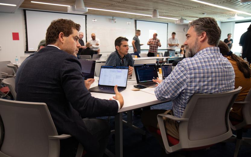 Breakout sessions in an AI workshop where small working groups discuss challenges and opportunities