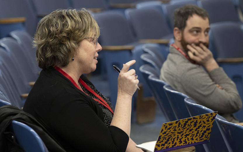 colleagues discuss a difficult problem in a small group sessioin