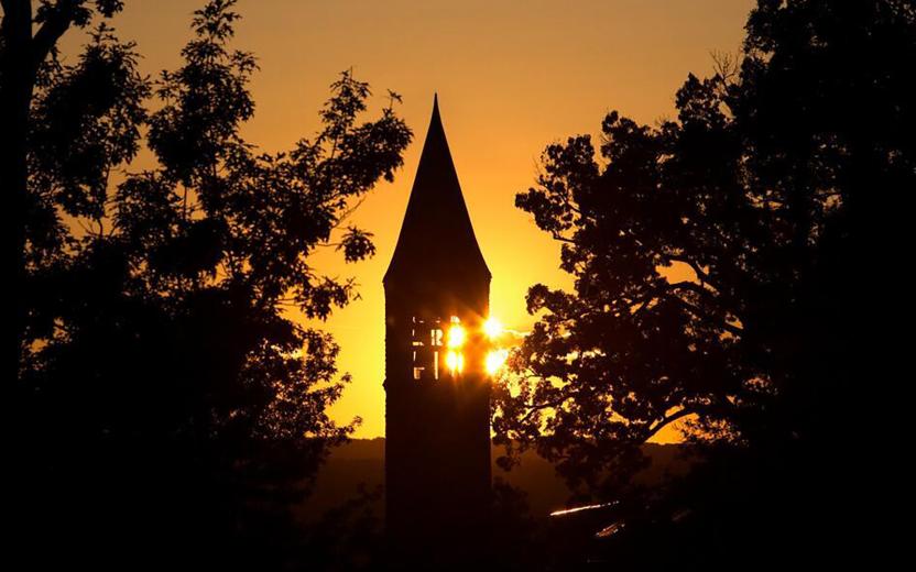 Sunrise over McGraw Tower in fall.
