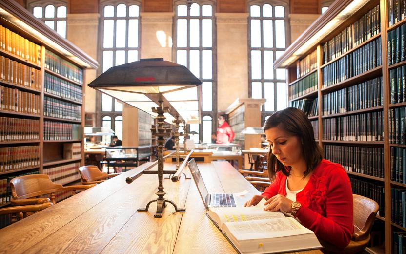 Student studying in a library.