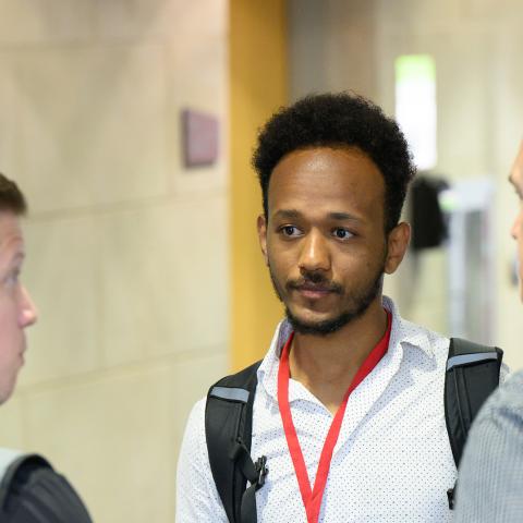 three colleagues discuss service management topics